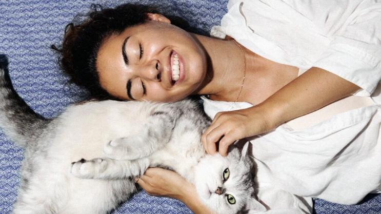 Why do humans love cats, according to science, and is it healthy?